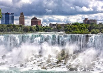 The American side of Niagara Falls with scenic river falls , parks and hotels